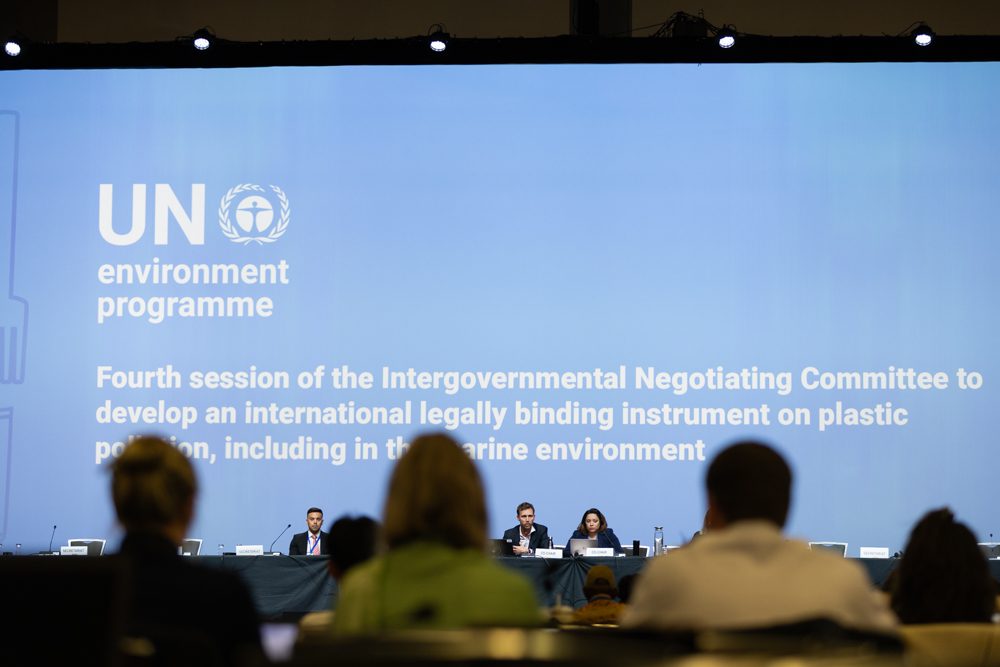 back of people's heads at INC-4 negotiations, plastics treaty