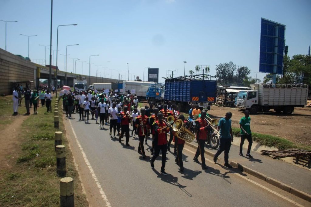 demonstration in Keyna. People on a road marching.