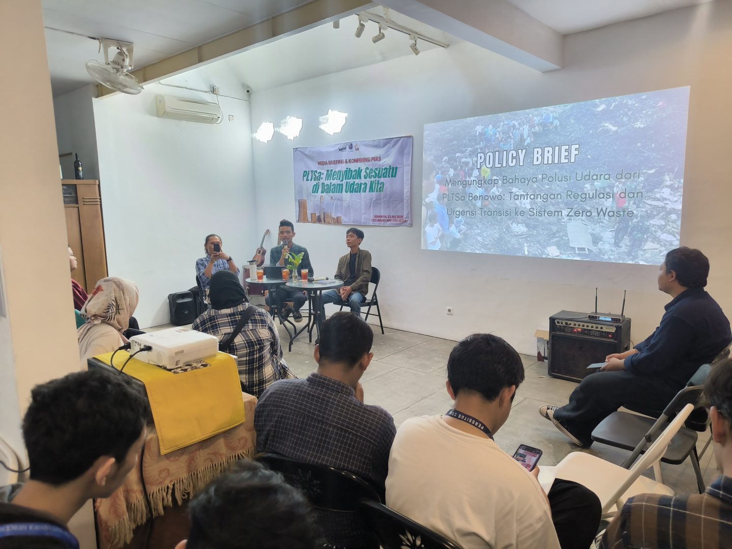 people gathered around a powerpoint presentation