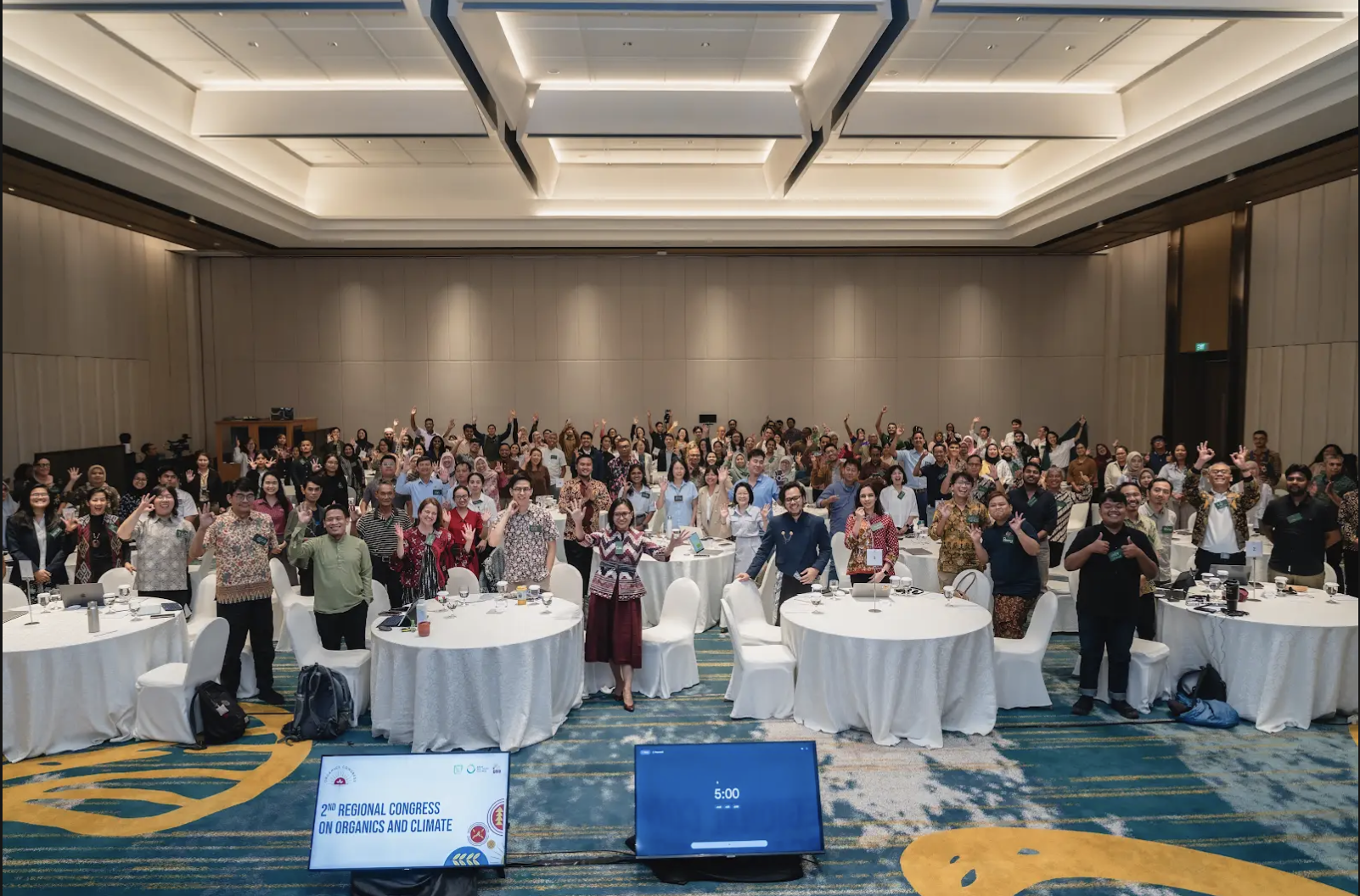 Large audience gathered at a zero waste and climate conference