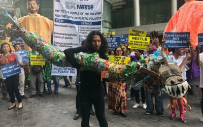 Green groups to Nestlé: “Own up, pay up, clean up your act!”